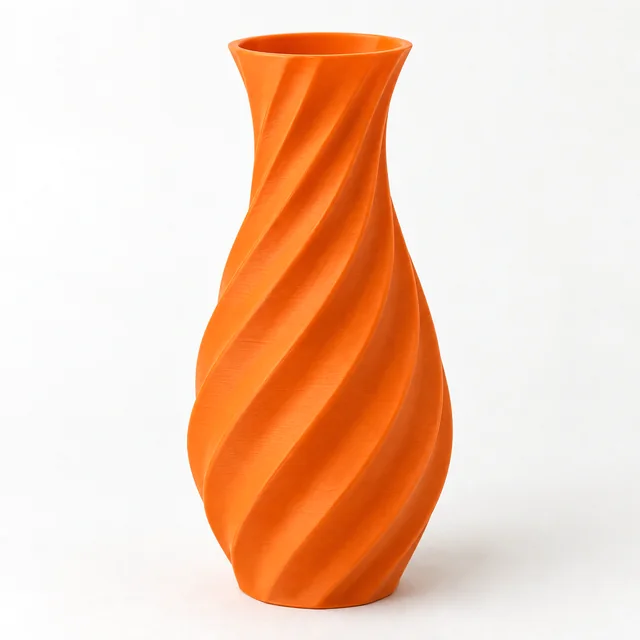 An orange 3D printed spiral vase.